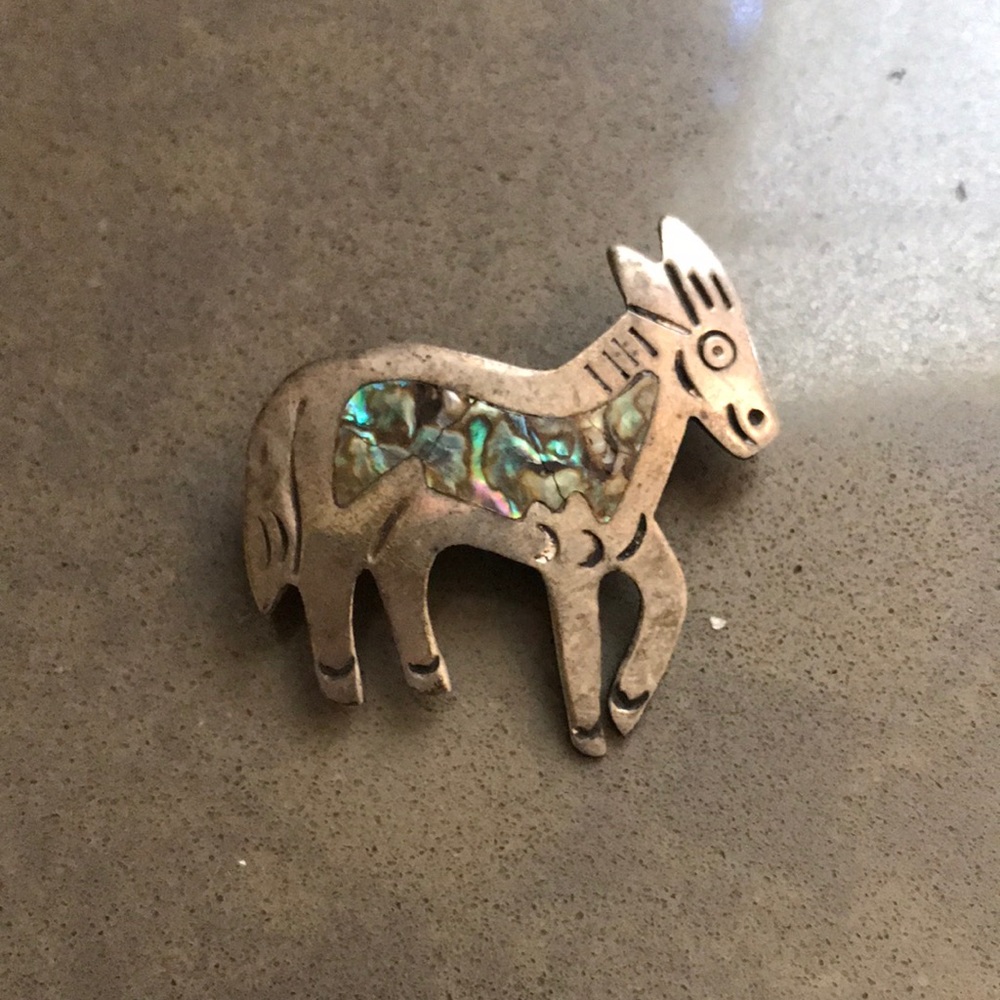 Vintage silver horse pin with inlaid abalone.